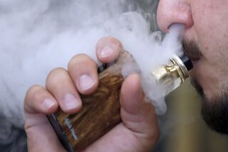 Keep calm and vape on UK embraces e cigarettes US cautious AP News